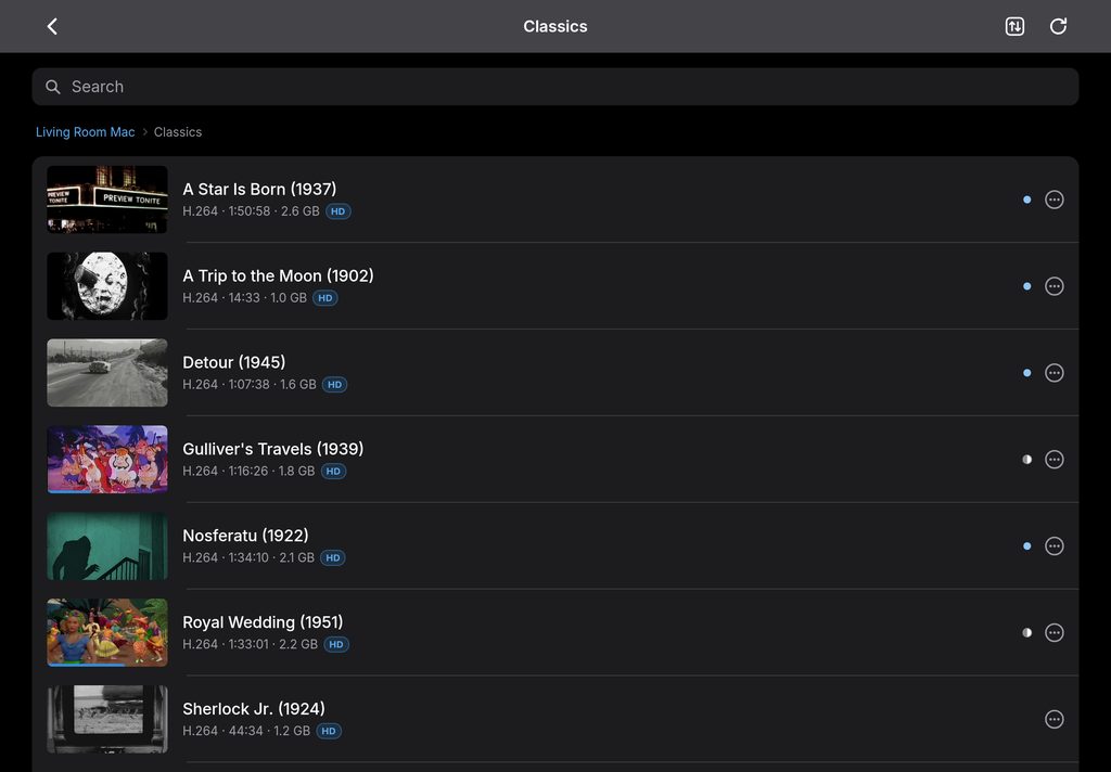 The top of the Classics folder on iPad: A Star Is Born, A Trip to the Moon, Detour, Gulliver's Travels, Nosferatu, Royal Wedding and Sherlock Jr., with thumbnails, running times, file sizes and progress.