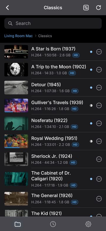 The Classics folder on iPhone: A Star Is Born, A Trip to the Moon, Detour, Gulliver's Travels, Nosferatu, Royal Wedding, Sherlock Jr., The Cabinet of Dr. Caligari, The General and more, with thumbnails, running times and file sizes.