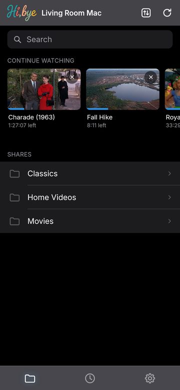 Hi, bye home screen on iPhone, with Charade and Fall Hike in Continue Watching above the Classics, Home Videos and Movies shares.